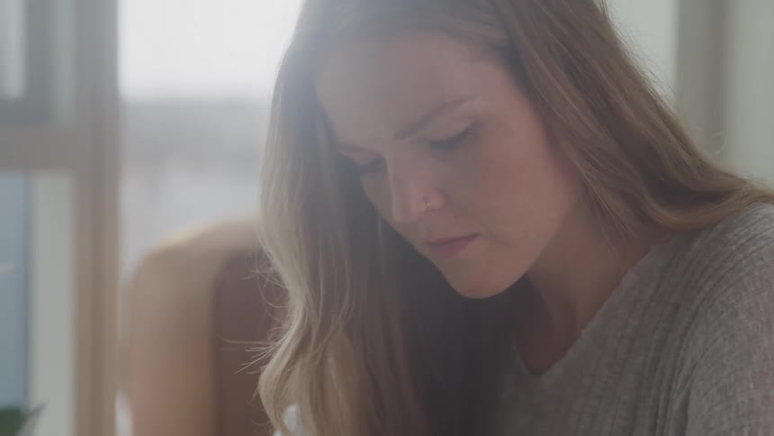A woman is looking down a something