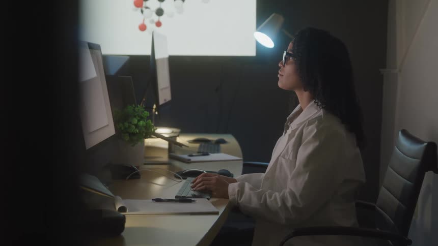 A footage of a lady working in the office