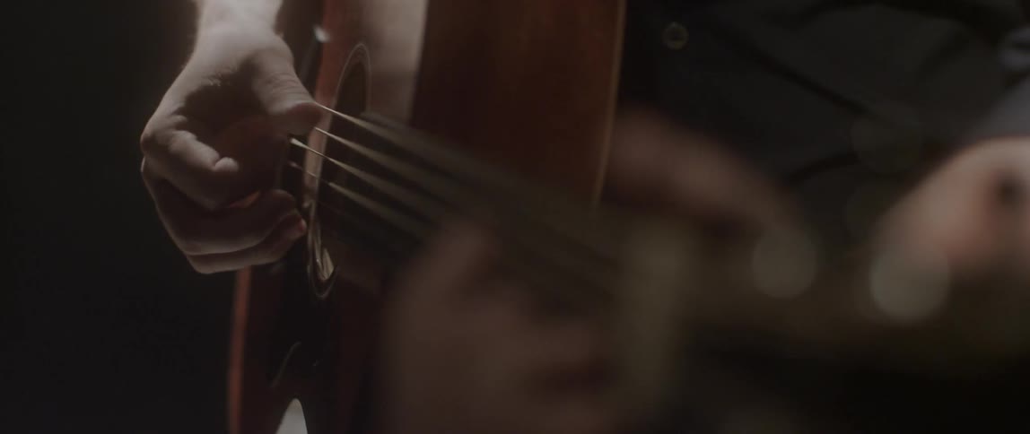 A person playing a guitar