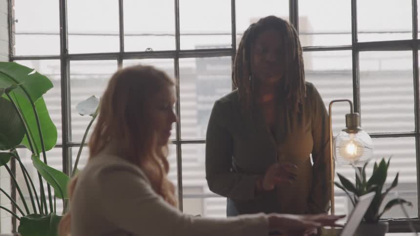 A footage of two ladies in the office