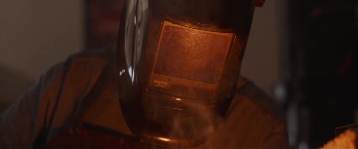 A footage of a blacksmith melting an iron
