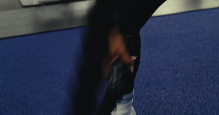 A footage of a person exercising in the gym