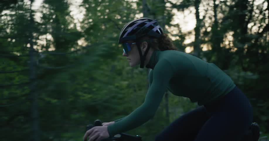 Woman cycling in the middle of the woods