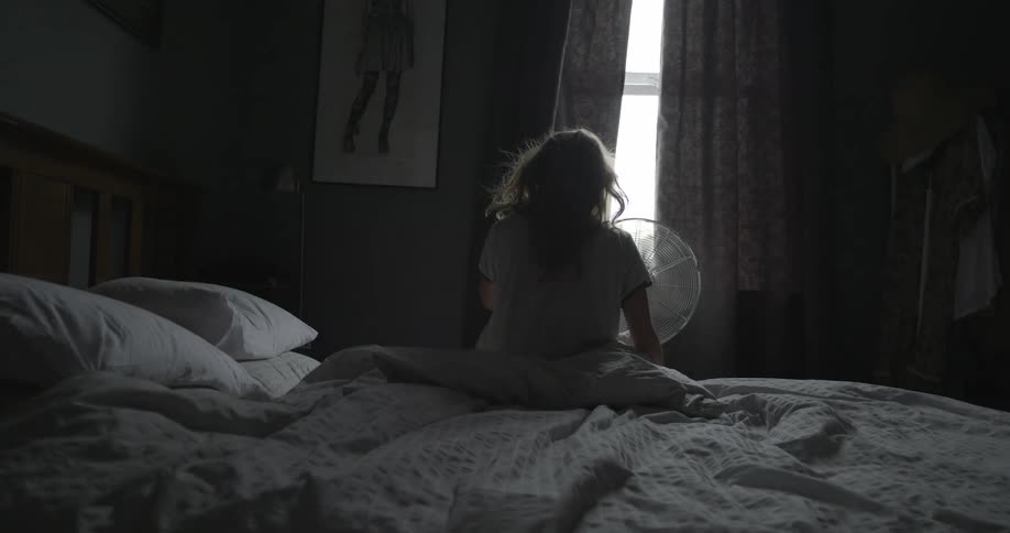 A person sitting on a bed