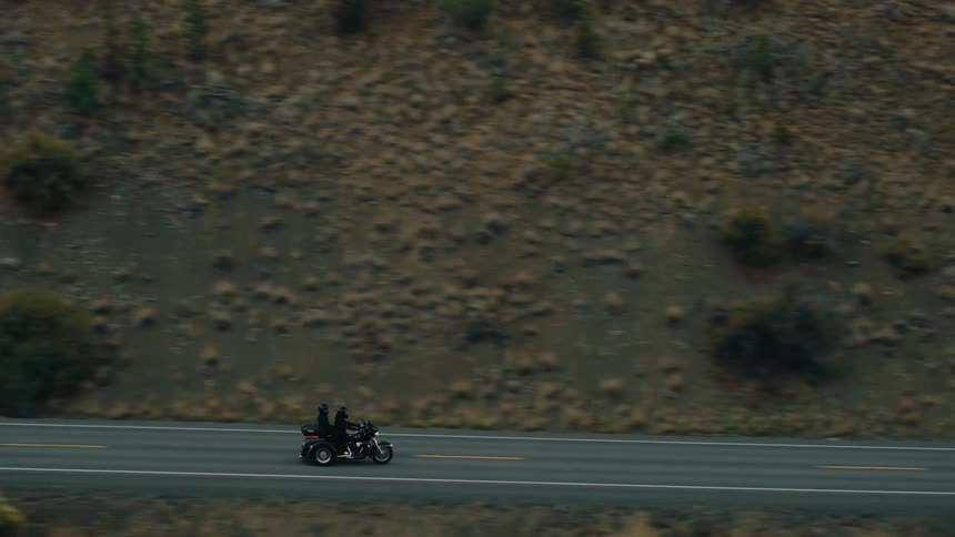 A large motorcycle is on a road trip