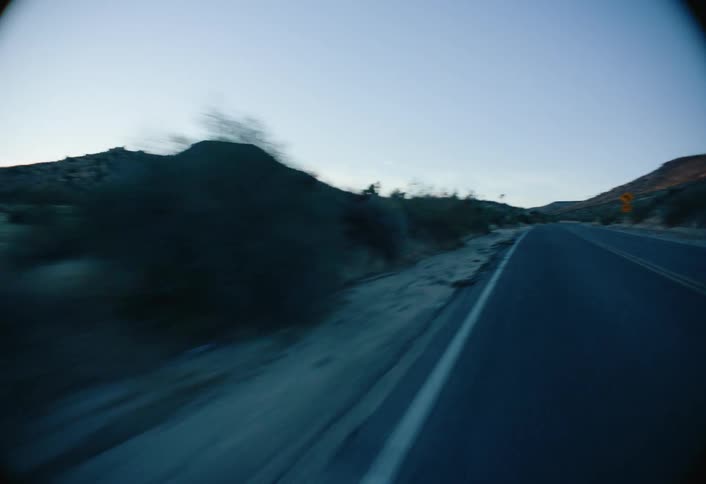 The road is empty by the hills