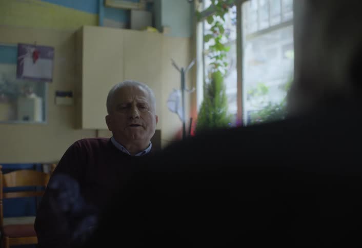 Two men are having a conversation