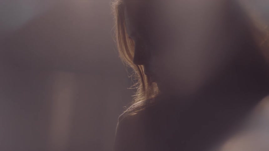 Light shines down on a woman's head