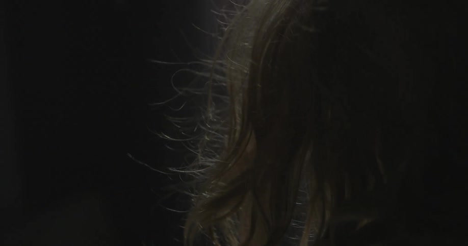 A person's hair blowing in the wind
