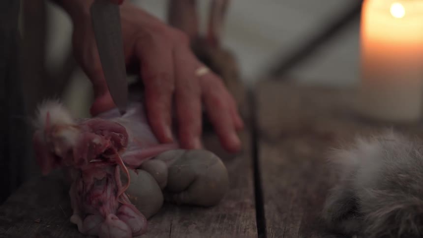 A footage of a person cutting a meat wide open