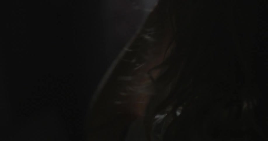 Girl's hair blowing in the breeze indoors