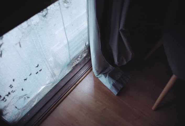 The room is empty with film over the window