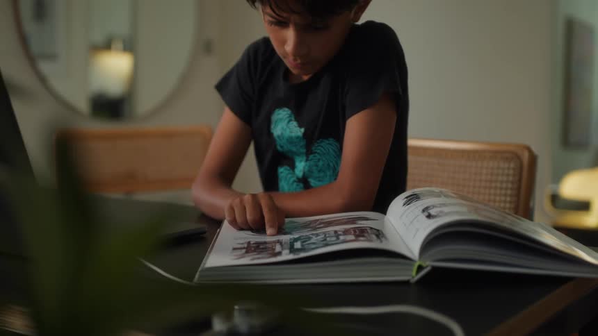 A footage of a boy reading a book