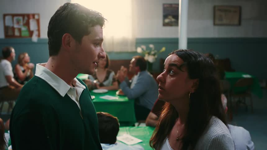 A footage of a man and a lady having a conversation in a restaurant