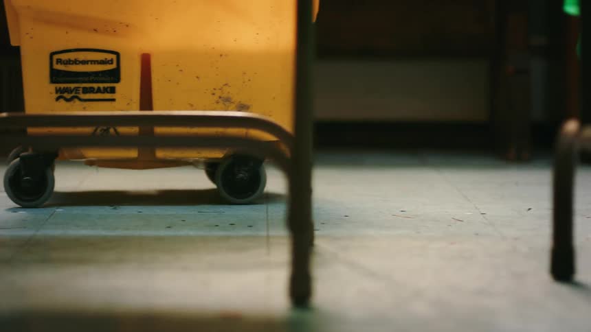 A footage of a man pushing a yellow plastic