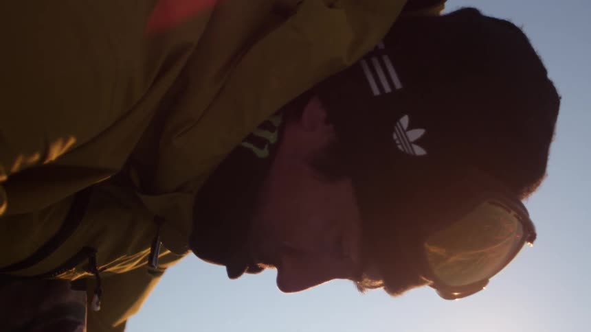 Strapping on a snowboard