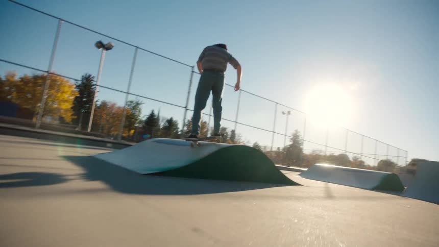 Man skateboarding on an outdoor rink