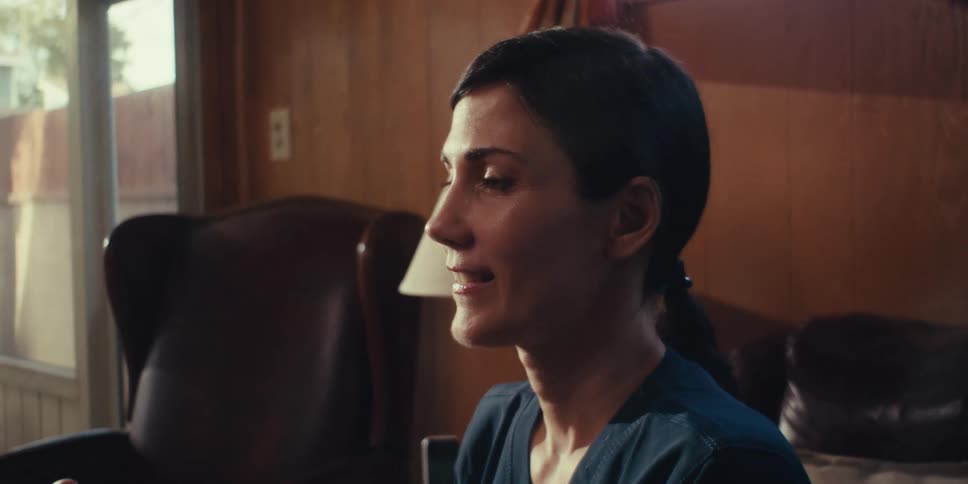 A woman is smiling in the room