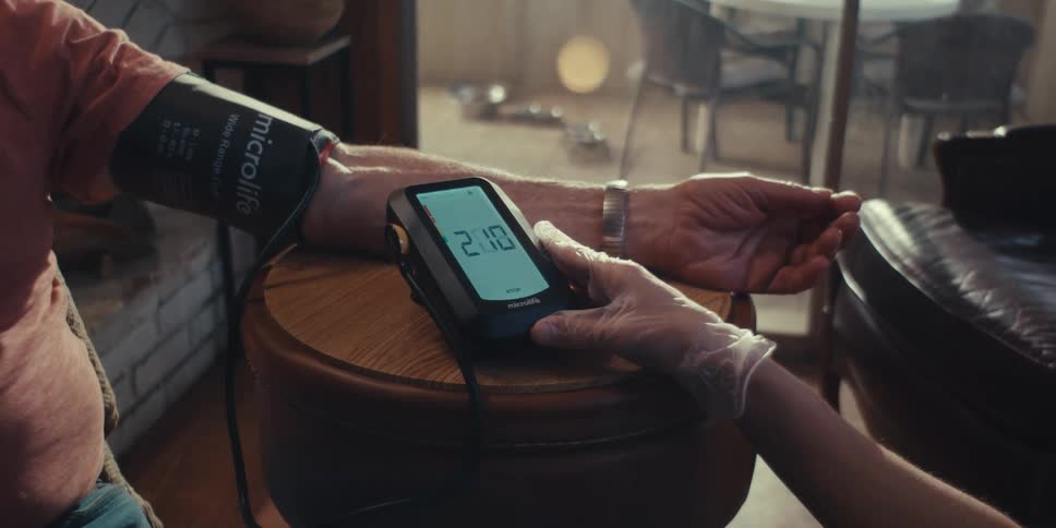 A man is having his blood pressure taken