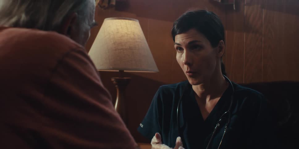 A nurse is explaining something to a patient