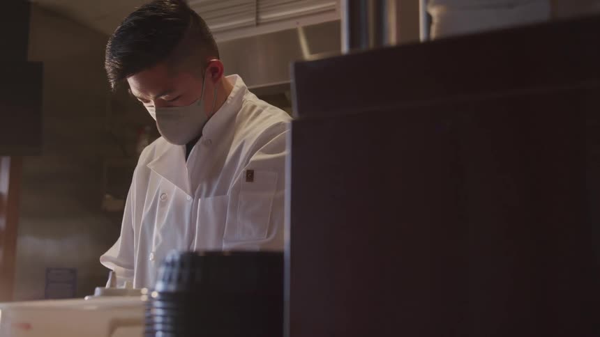 A doctor is working in his lab at his job site