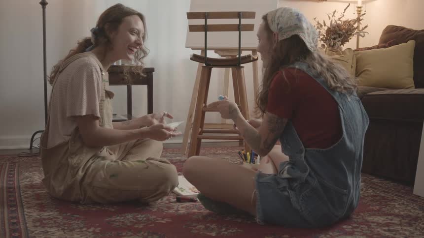 A footage of two ladies in a sitting room
