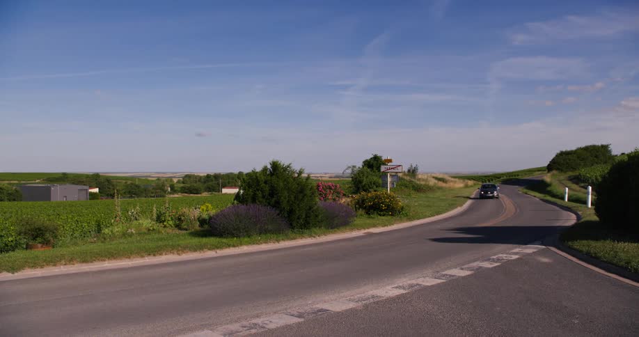 A car drives down a road