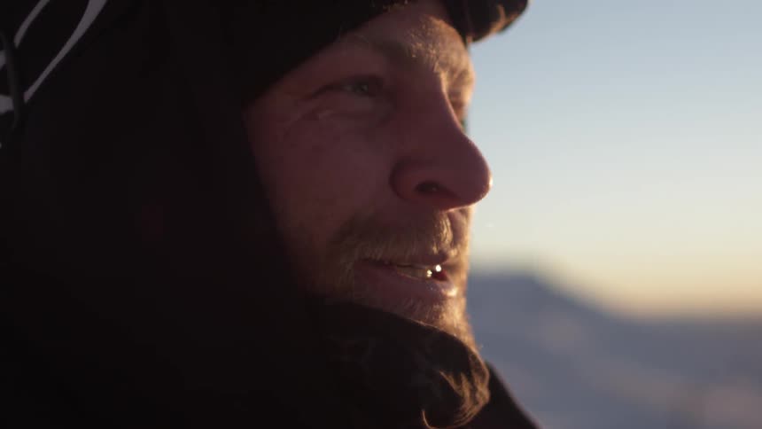 A man smiles