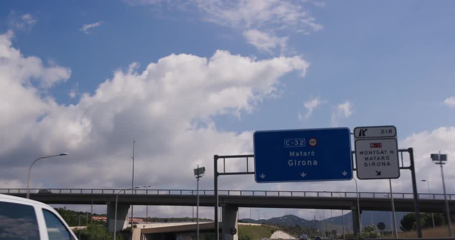 Traffic moves down a highway on both sides