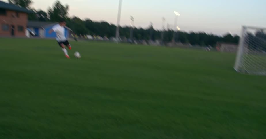 People kicking around  a soccer ball