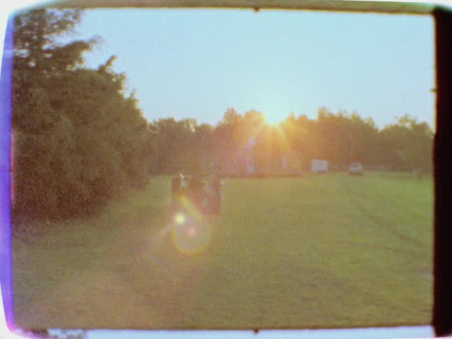 A four wheeler parked in a field on a sunny day