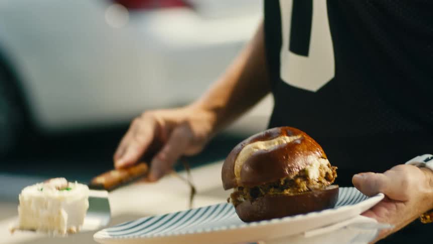 A footage of a person serving food on the plate