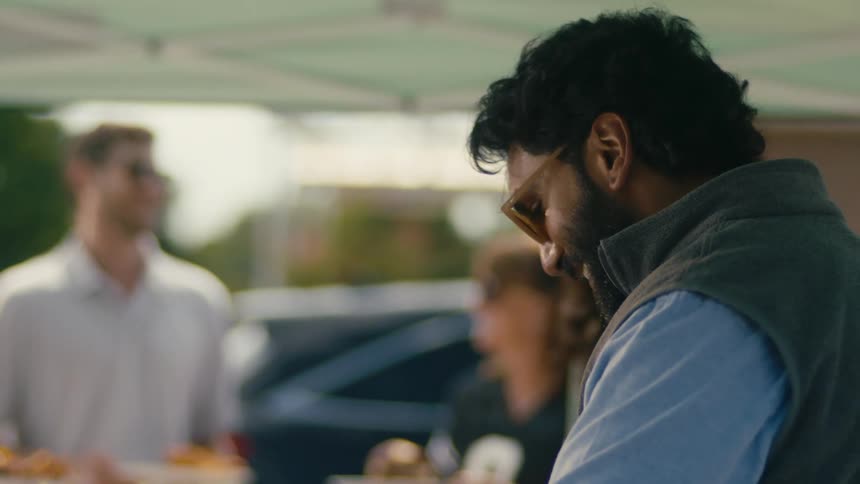 Group of friends are getting food together outdoors