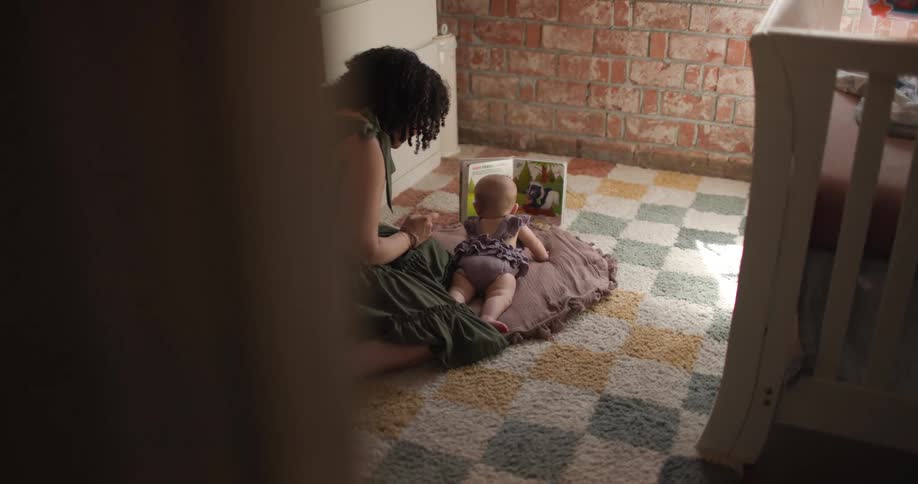 A footage of a woman laying down with a baby