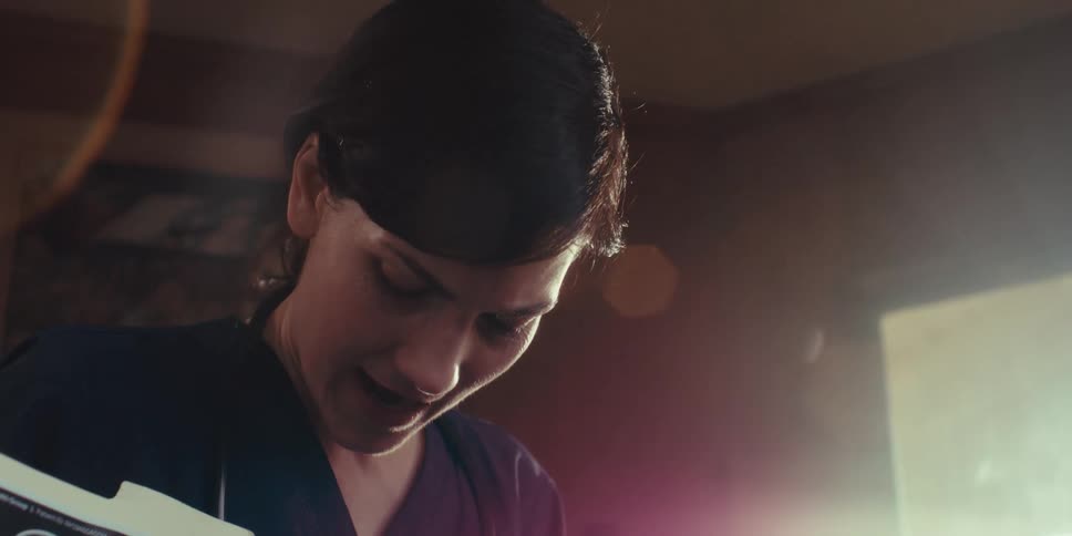 A nurse talks and smiles