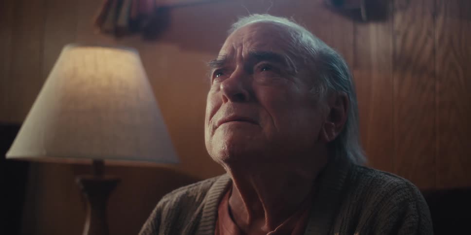 The sad man is talking at home