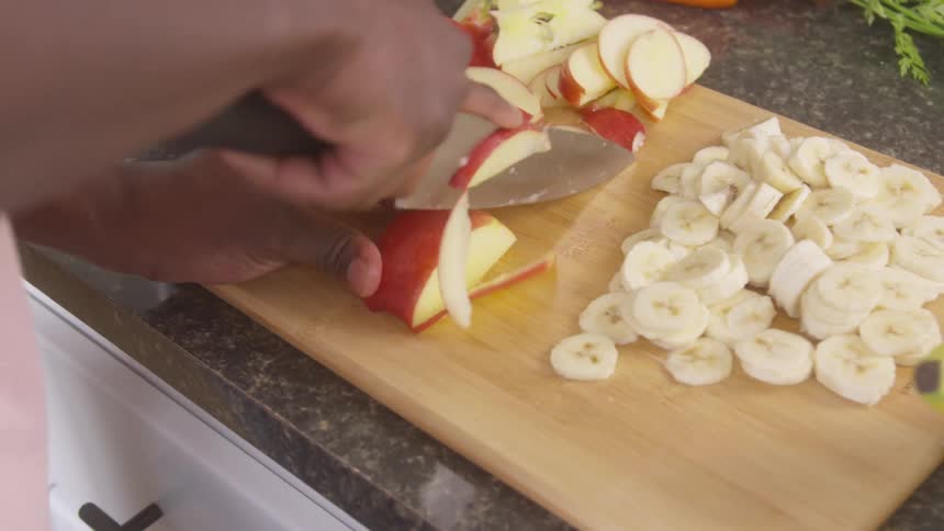A footage of a person slicing fruits