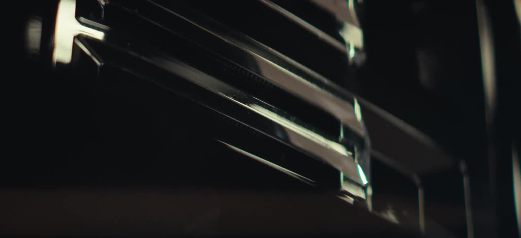 An extreme close up of a shiny metallic surface