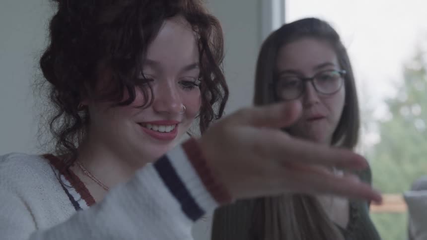 Girls are talking and smiling
