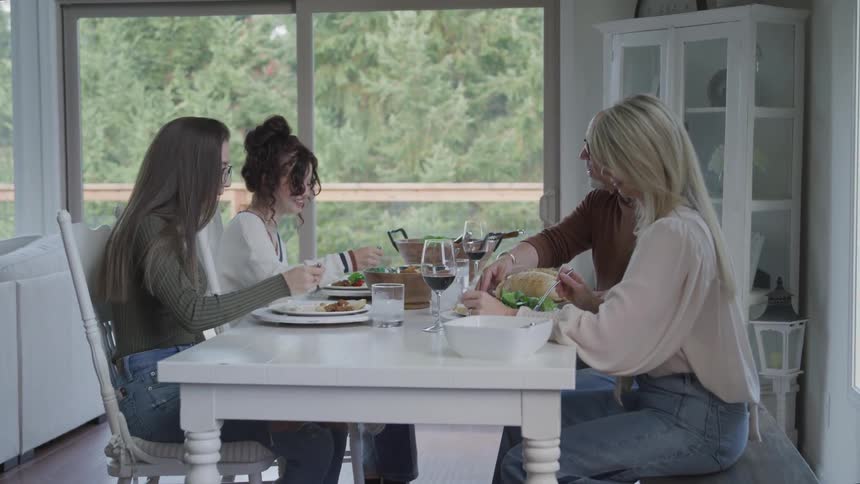 Family sitting at the table having lunch