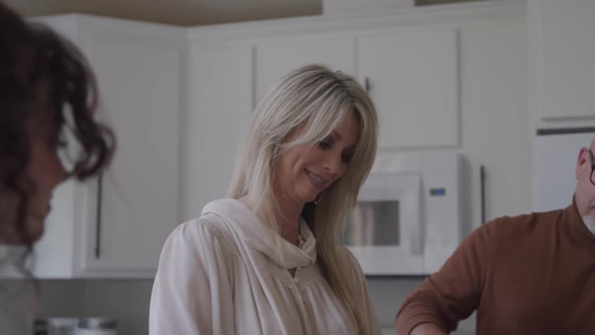 Family in the kitchen interacting