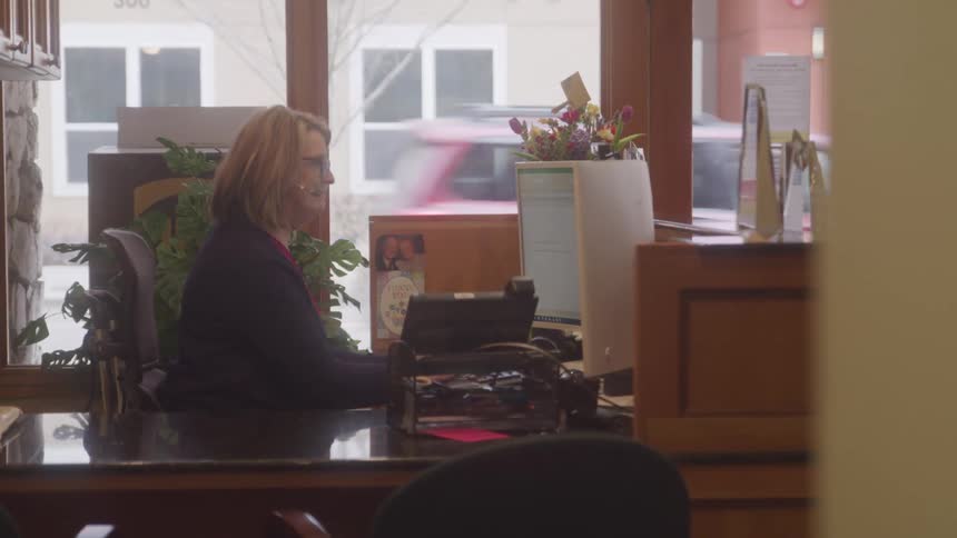 A footage of a woman working in the office