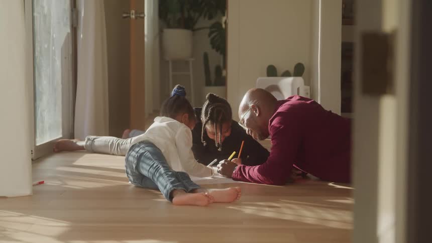 A footage of a person teaching the kids indoor