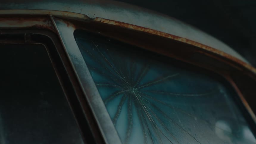 Cracked rusty vehicle glass