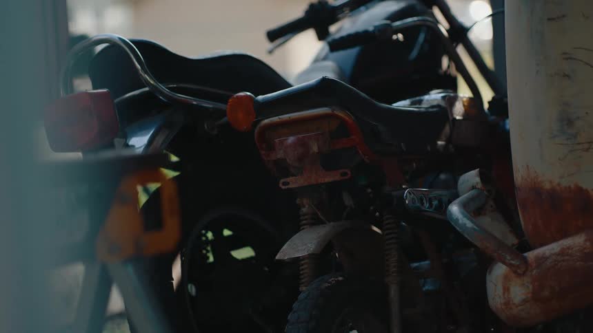 Motorcycles parked side by side