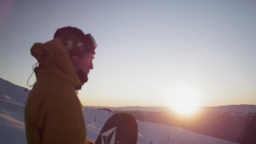A person holding a snowboard