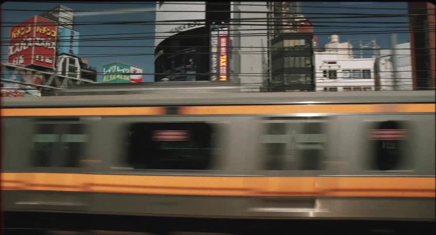 A footage of a train moving in a community