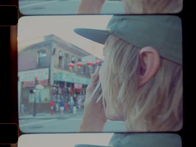 A man is taking photos at the intersection