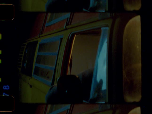 Images flash rapidly viewed through the side window of a dark yellow van
