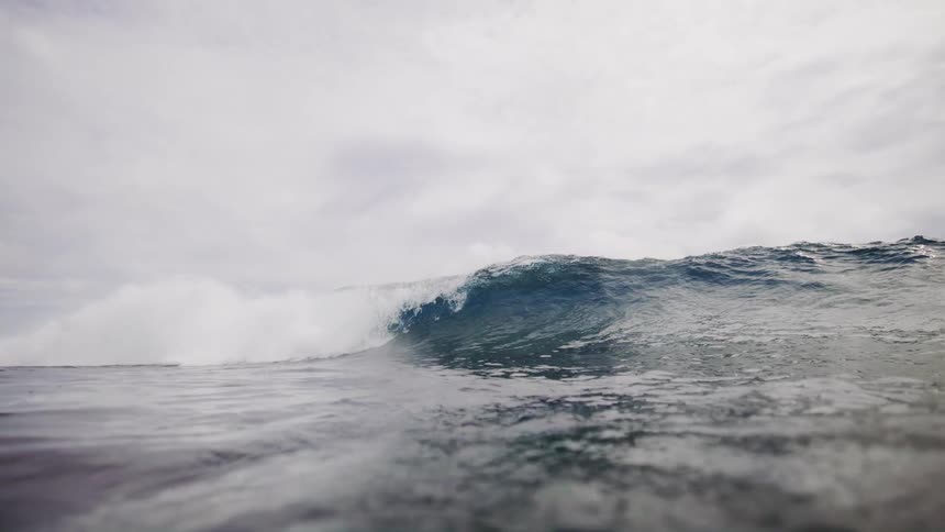 Landscape of a tubular wave in an ocean on a cloudy day